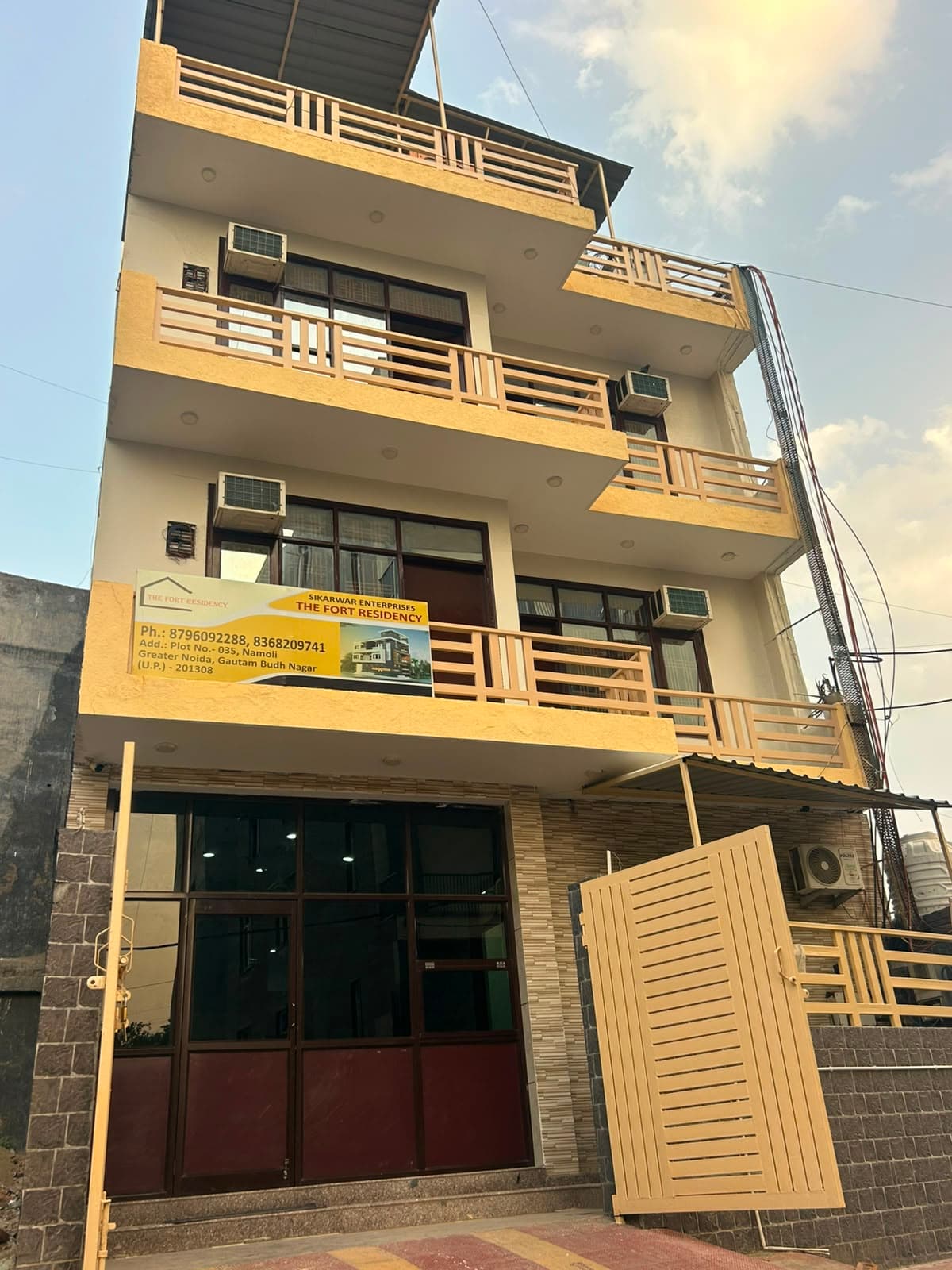 Exterior view of The Fort Residency showcasing the building facade and entrance