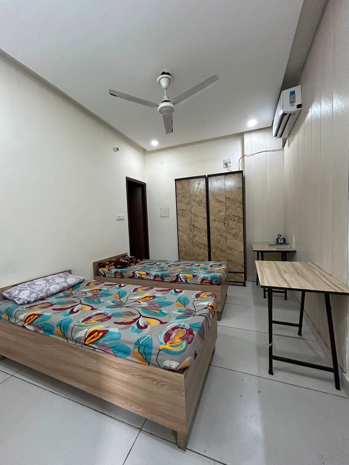 Spacious double bedroom at The Fort Residency with comfortable bedding and modern furnishings