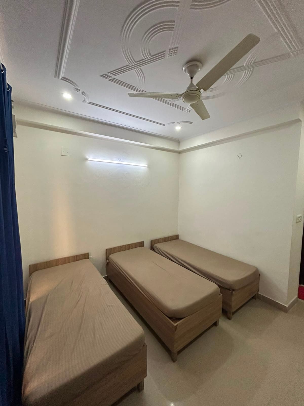Well-lit living space at The Fort Residency with compact design
